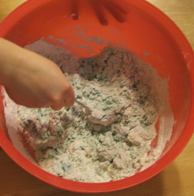 play dough mixing with spoon