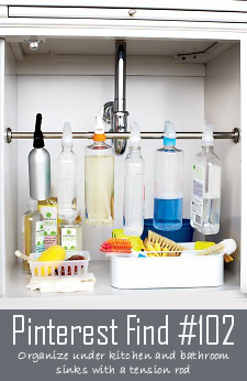 Use A Tension Rod To Organize Under Your Sink