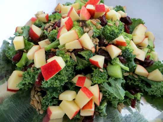 mixing-kale-salad-ingredients-in-bowl-sm