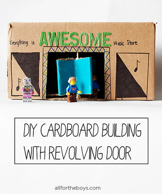 07_-_all_for_the_boys_-_cardboard_building_with_revolving_door