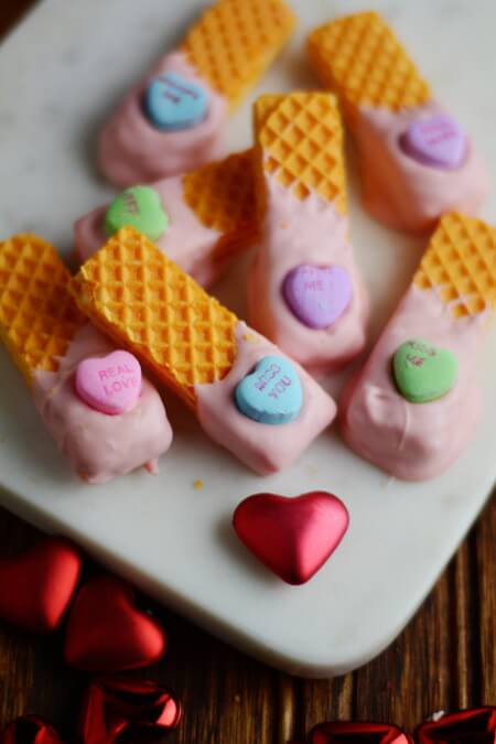 Wafer cookies dipped in chocolate with conversation hearts