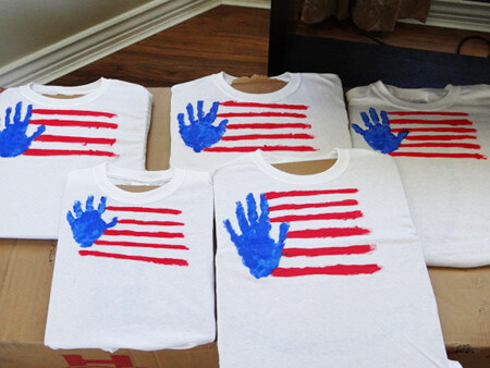 painted handprint flag t-shirts on cardboard